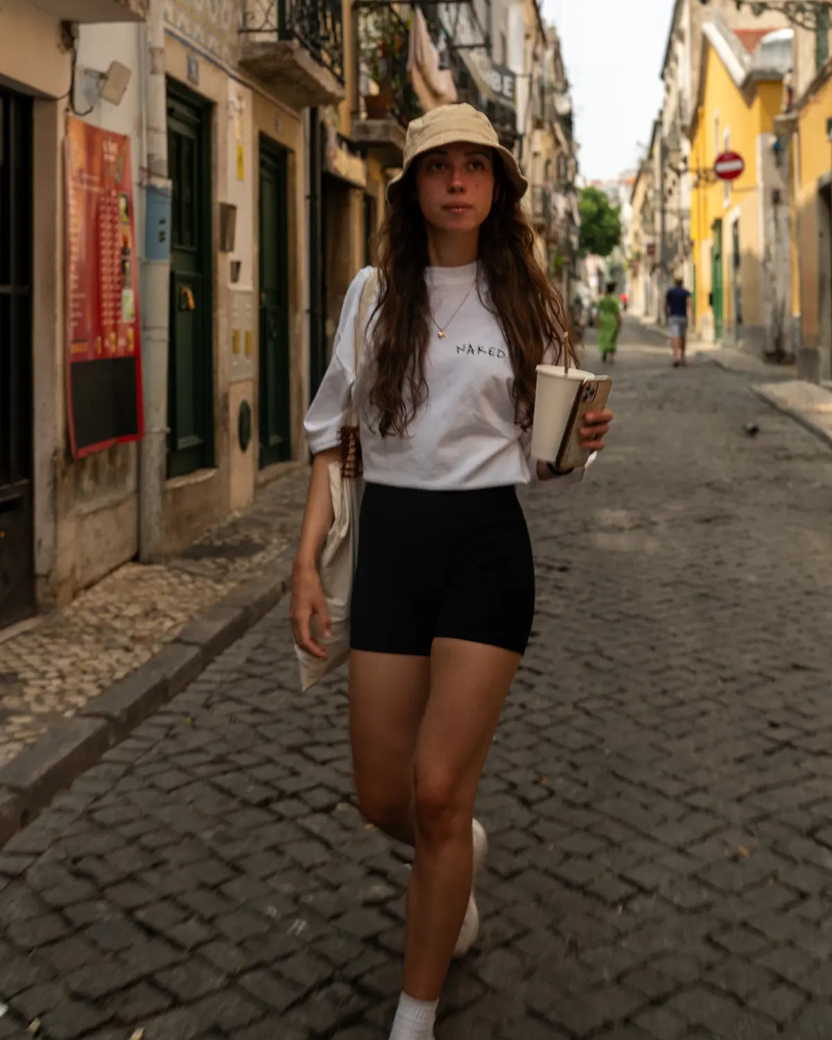 Beautiful girl Walking in a narrow street