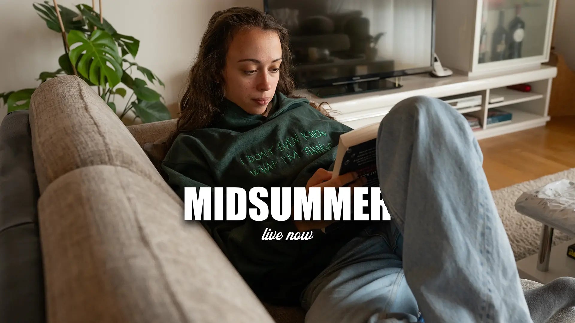 A girl on the couch wearing our latest collection called Midsummer
